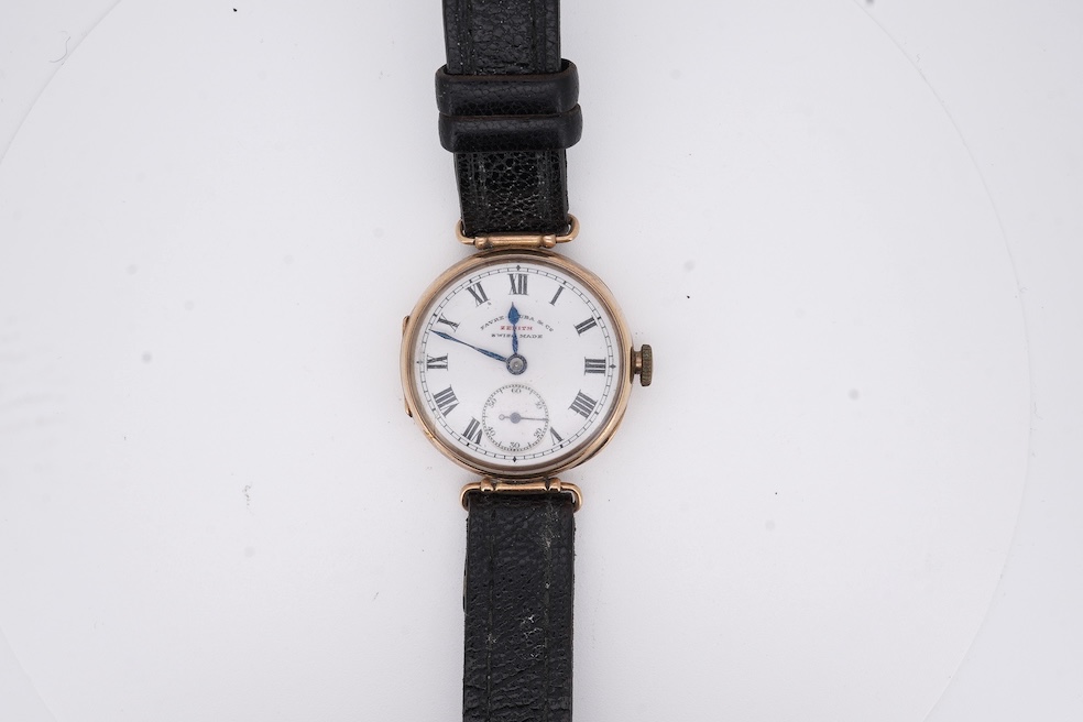 An early 20th century 9ct gold Zenith manual wind wrist watch, retailed by Favre Leuba, with Roman dial and subsidiary seconds, case diameter 28mm, on an associated leather strap. Condition - poor to fair